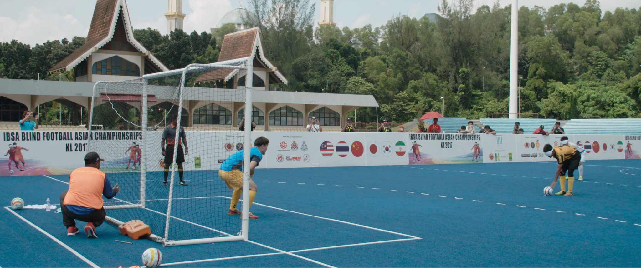 Blind footballer Pokyi prepares to take a penalty kick against South Korea during the IBSA Blind Football Asian Championships.